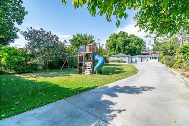 10541 Cliota St, Whittier, CA 90601 - view of grassy yard featuring a playground