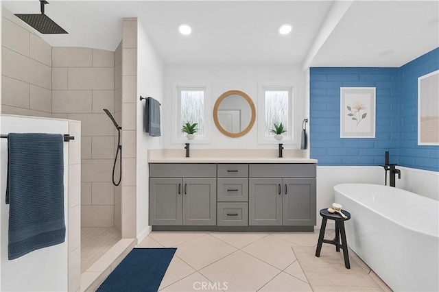 10541 Cliota St, Whittier, CA 90601 - full bathroom featuring a walk in shower, a soaking tub, double vanity, tile patterned floors, and recessed lighting