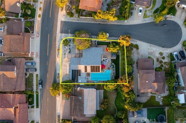 birds eye view of property with a residential view