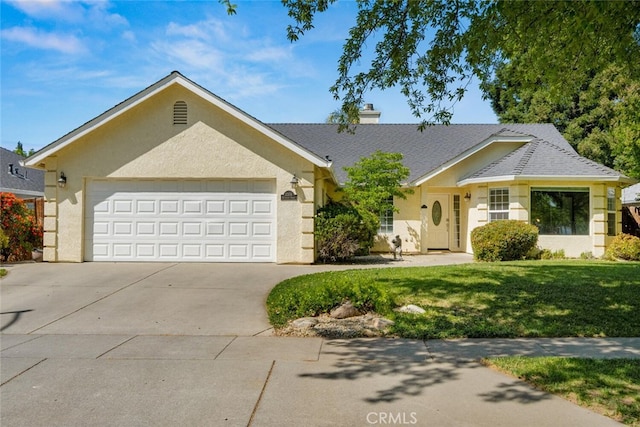 single story home featuring a chimney, driveway, a garage, stucco siding, and a front lawn