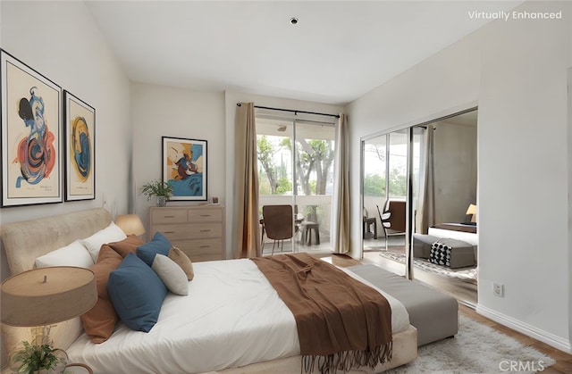bedroom with access to outside, baseboards, a closet, and wood finished floors