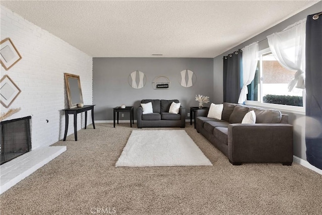 carpeted living room with baseboards, a fireplace, visible vents, and a textured ceiling