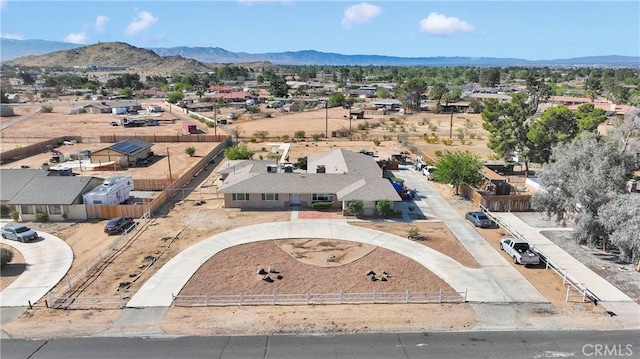 drone / aerial view featuring a mountain view and a residential view