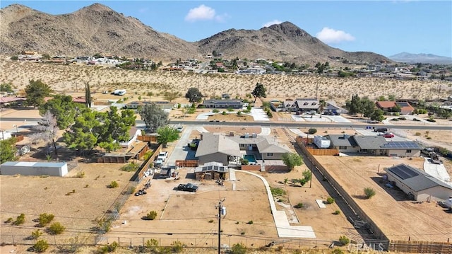 birds eye view of property with a mountain view and a residential view