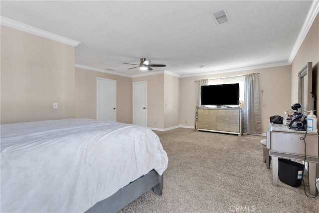 bedroom with crown molding, carpet flooring, a ceiling fan, and visible vents