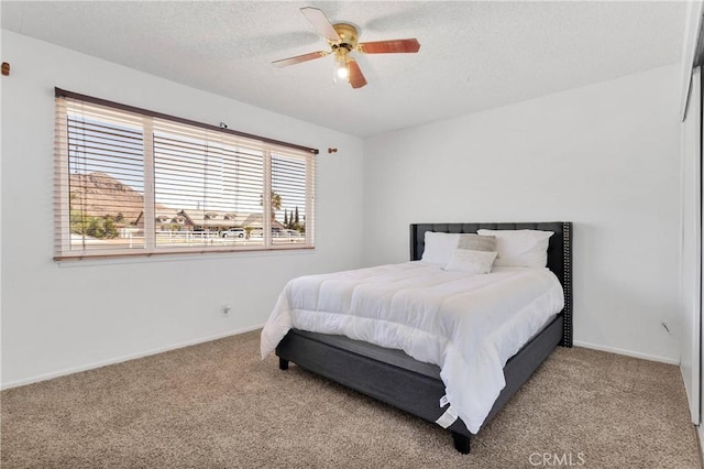 bedroom with carpet flooring, multiple windows, and baseboards