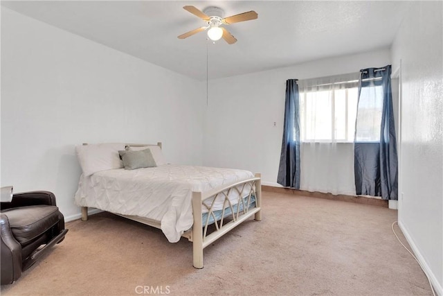 bedroom featuring carpet flooring, baseboards, and a ceiling fan
