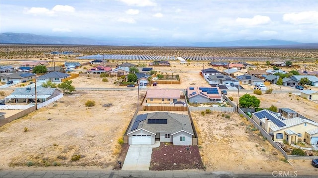 drone / aerial view featuring a mountain view and a residential view