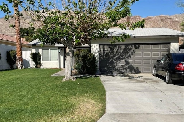 52415 Avenida Vallejo Ln, Quinta, CA 92253 - single story home with an attached garage, driveway, a front lawn, and stucco siding