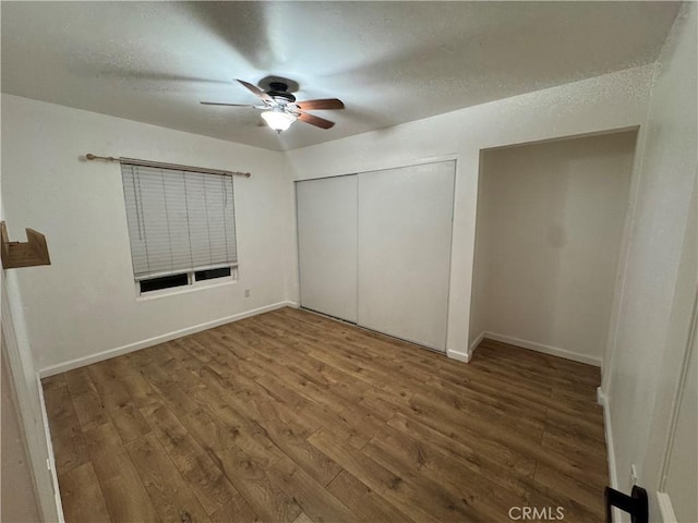 52415 Avenida Vallejo Ln, Quinta, CA 92253 - unfurnished bedroom with wood finished floors, a closet, baseboards, a ceiling fan, and a textured ceiling