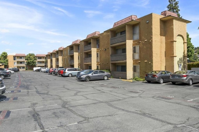 view of property with uncovered parking
