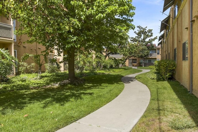surrounding community featuring a lawn