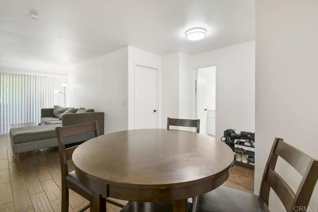 dining space with light wood-style flooring