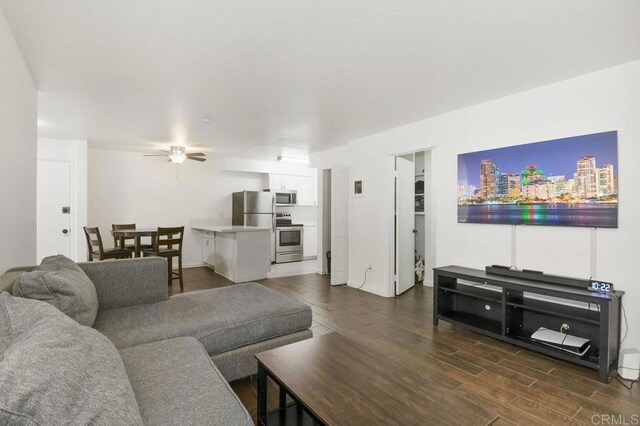 6955 Alvarado Rd Unit 30, San Diego, CA 92120 - living room featuring dark wood-style flooring, ceiling fan, and a view of city