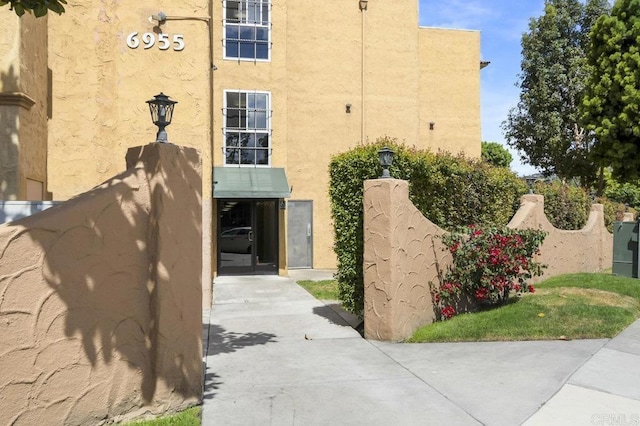 6955 Alvarado Rd Unit 30, San Diego, CA 92120 - view of home's exterior with stucco siding