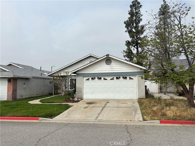 ranch-style house with a garage, driveway, and a front yard