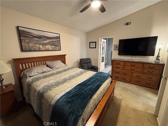 bedroom with carpet, a textured ceiling, visible vents, ceiling fan, and lofted ceiling