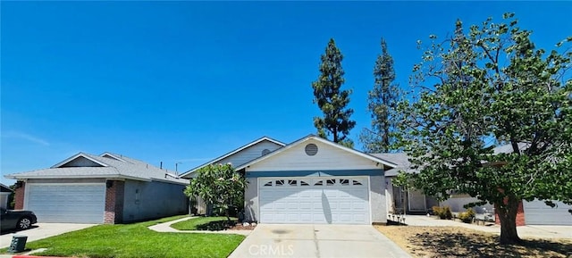 15957 Randall Ave Unit 34, Fontana, CA 92335 - ranch-style house with concrete driveway, a front lawn, and an attached garage