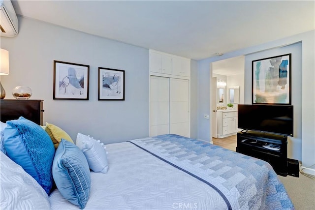 774 Via Los Altos Unit P, Laguna Woods, CA 92637 - bedroom featuring an AC wall unit, ensuite bath, and a closet