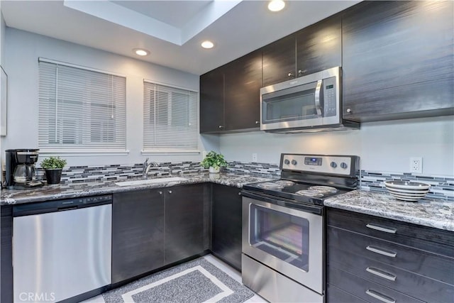 774 Via Los Altos Unit P, Laguna Woods, CA 92637 - kitchen with stainless steel appliances, a sink, recessed lighting, and light stone counters