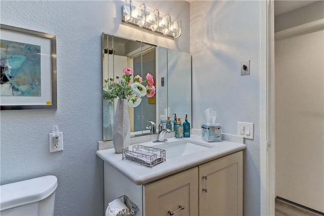 774 Via Los Altos Unit P, Laguna Woods, CA 92637 - bathroom featuring toilet, vanity, and a chandelier