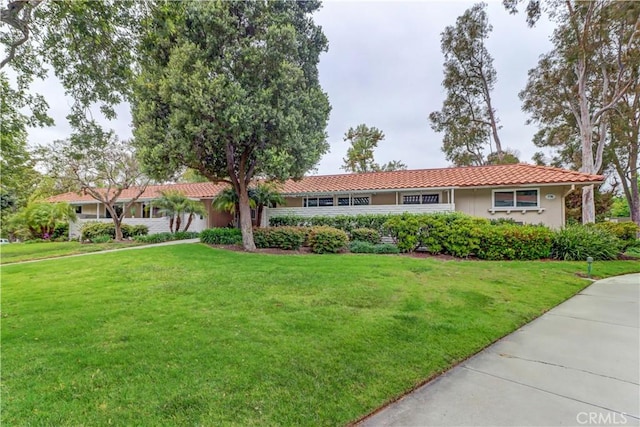 774 Via Los Altos Unit P, Laguna Woods, CA 92637 - ranch-style house featuring a front lawn, a tile roof, and stucco siding