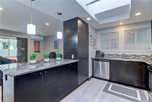 774 Via Los Altos Unit P, Laguna Woods, CA 92637 - kitchen featuring stainless steel dishwasher, light wood-style flooring, a peninsula, a sink, and stone counters