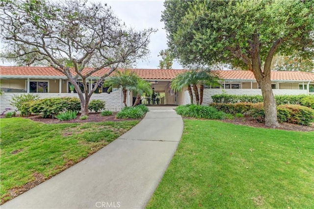774 Via Los Altos Unit P, Laguna Woods, CA 92637 - view of front facade featuring a front lawn
