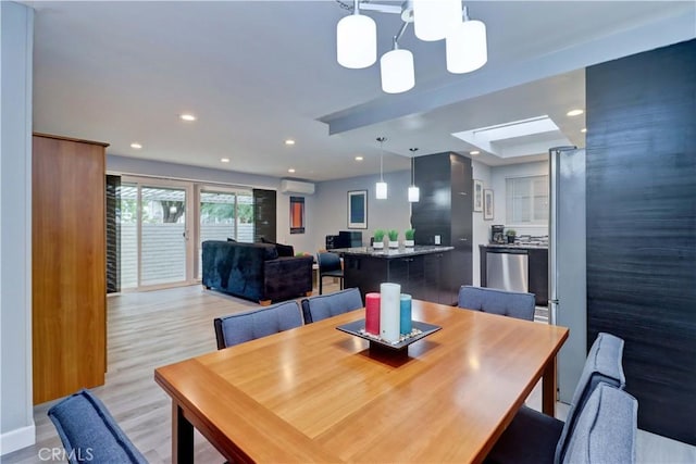 774 Via Los Altos Unit P, Laguna Woods, CA 92637 - dining space featuring a wall unit AC, a chandelier, light wood-style flooring, and recessed lighting