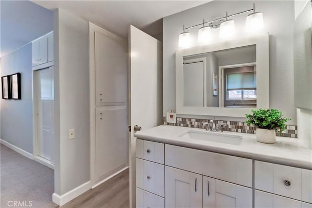 774 Via Los Altos Unit P, Laguna Woods, CA 92637 - bathroom with vanity, backsplash, and baseboards