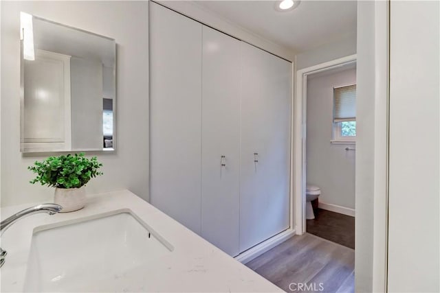 774 Via Los Altos Unit P, Laguna Woods, CA 92637 - bathroom with toilet, wood finished floors, recessed lighting, baseboards, and vanity