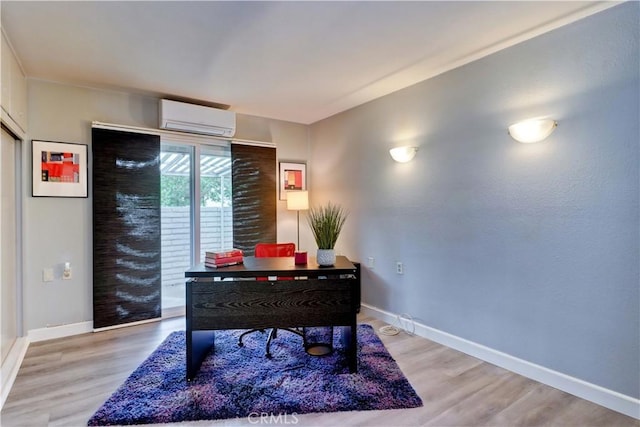 774 Via Los Altos Unit P, Laguna Woods, CA 92637 - office space with a wall unit AC, baseboards, and light wood-type flooring