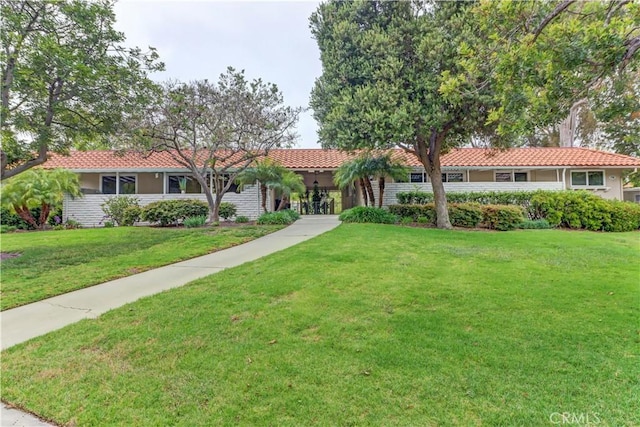 774 Via Los Altos Unit P, Laguna Woods, CA 92637 - ranch-style home with a front lawn, a tiled roof, and stucco siding