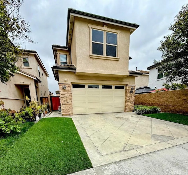 view of front of home featuring a front yard, a garage, stucco siding, concrete driveway, and stone siding