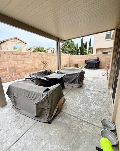 view of patio featuring a grill and a fenced backyard
