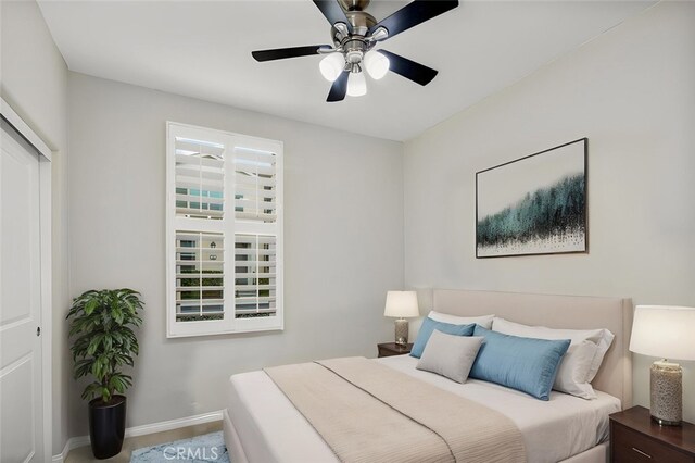 102 Rose Arch Unit 23, Irvine, CA 92620 - bedroom with baseboards and a ceiling fan