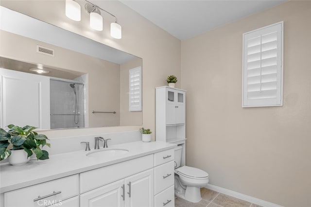 102 Rose Arch Unit 23, Irvine, CA 92620 - bathroom with a shower, toilet, vanity, tile patterned floors, and baseboards