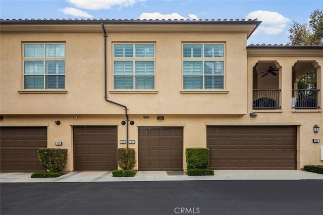 102 Rose Arch Unit 23, Irvine, CA 92620 - townhome / multi-family property featuring a garage and stucco siding