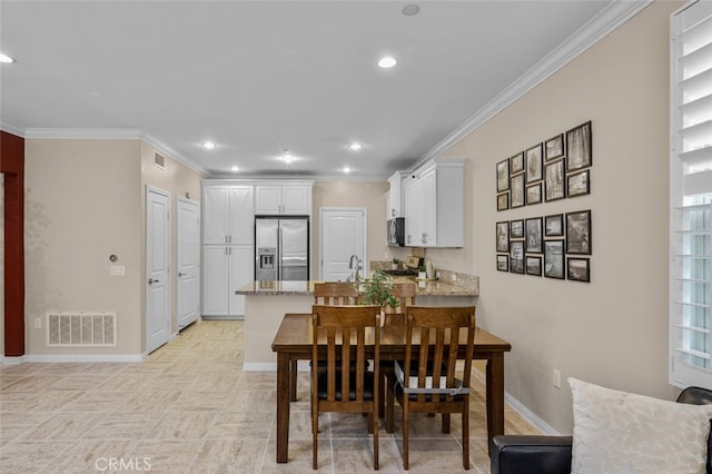 102 Rose Arch Unit 23, Irvine, CA 92620 - dining room with ornamental molding, recessed lighting, and baseboards