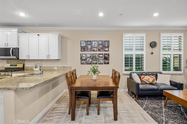 102 Rose Arch Unit 23, Irvine, CA 92620 - dining space with ornamental molding, recessed lighting, and baseboards