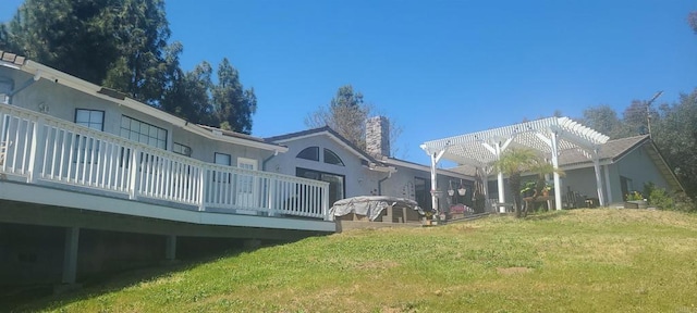 view of yard featuring a pergola and a wooden deck