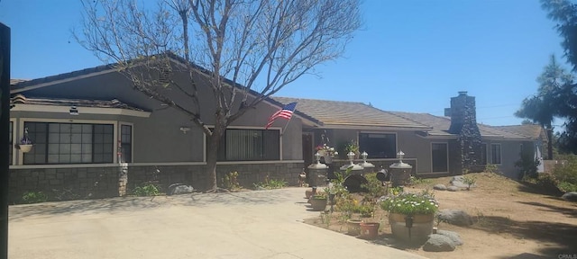 back of property featuring a chimney