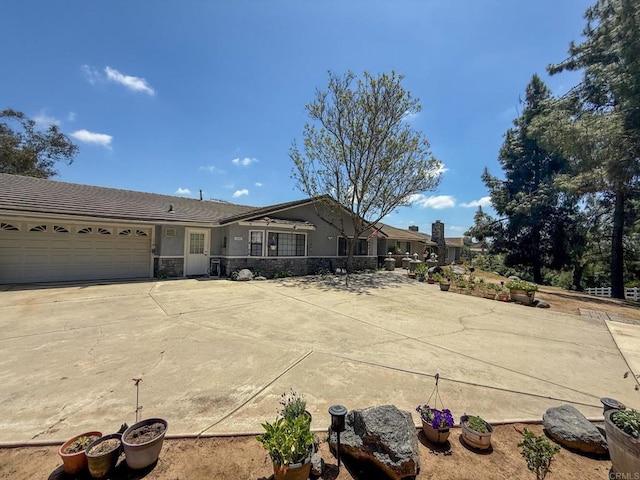 3048 Jason Rd, Fallbrook, CA 92028 - ranch-style home with a garage, stone siding, stucco siding, and driveway