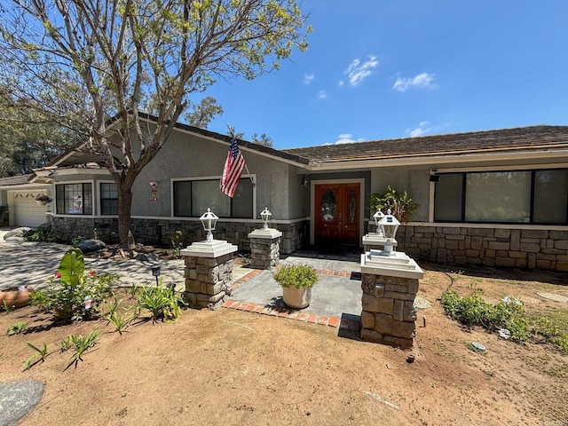 3048 Jason Rd, Fallbrook, CA 92028 - ranch-style house with stone siding, stucco siding, and a garage