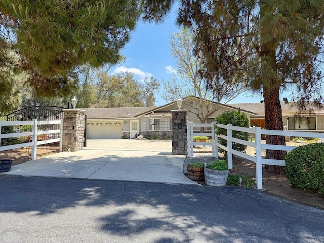 3048 Jason Rd, Fallbrook, CA 92028 - ranch-style home with an attached garage, concrete driveway, and stone siding