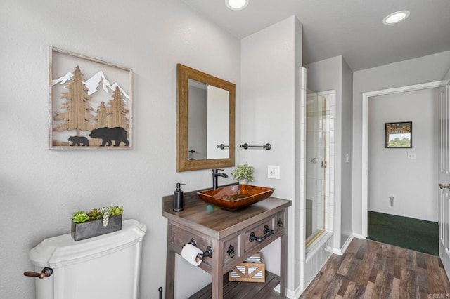 3048 Jason Rd, Fallbrook, CA 92028 - bathroom featuring wood finished floors, toilet, a shower with door, recessed lighting, and vanity