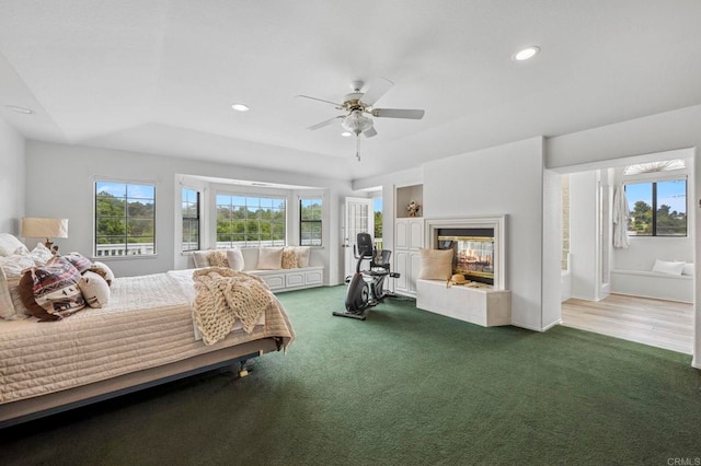 3048 Jason Rd, Fallbrook, CA 92028 - carpeted bedroom featuring multiple windows, a multi sided fireplace, recessed lighting, a tray ceiling, and a ceiling fan
