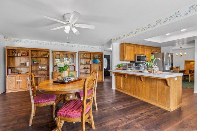 3048 Jason Rd, Fallbrook, CA 92028 - dining room featuring a chandelier, dark wood-style floors, a ceiling fan, and recessed lighting