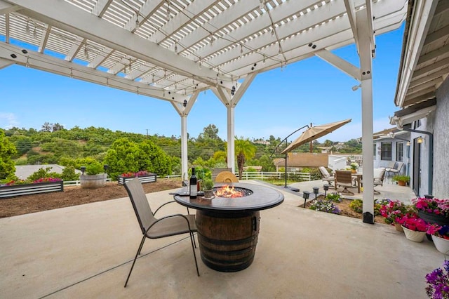 3048 Jason Rd, Fallbrook, CA 92028 - view of patio featuring a fire pit, outdoor dining space, and a pergola