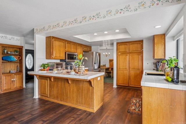 3048 Jason Rd, Fallbrook, CA 92028 - kitchen with appliances with stainless steel finishes, a peninsula, a sink, tile counters, and recessed lighting